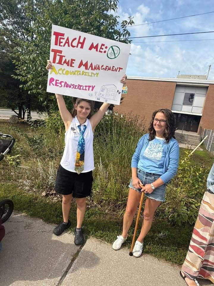 A student in Parry Sound protesting having to learn online amid construction delays.