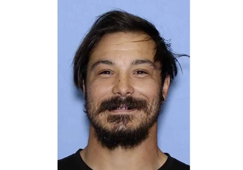 This undated photo provided by the Wenatchee Police Department shows Travis Caleb Decker, who is wanted in connection with the deaths of his three daughters.
