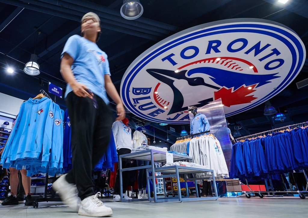 Fans walk through the Toronto Blue Jays merchandise store outside Rogers Centre in Toronto, on Saturday, Oct. 11, 2025. THE CANADIAN PRESS/Sammy Kogan.
