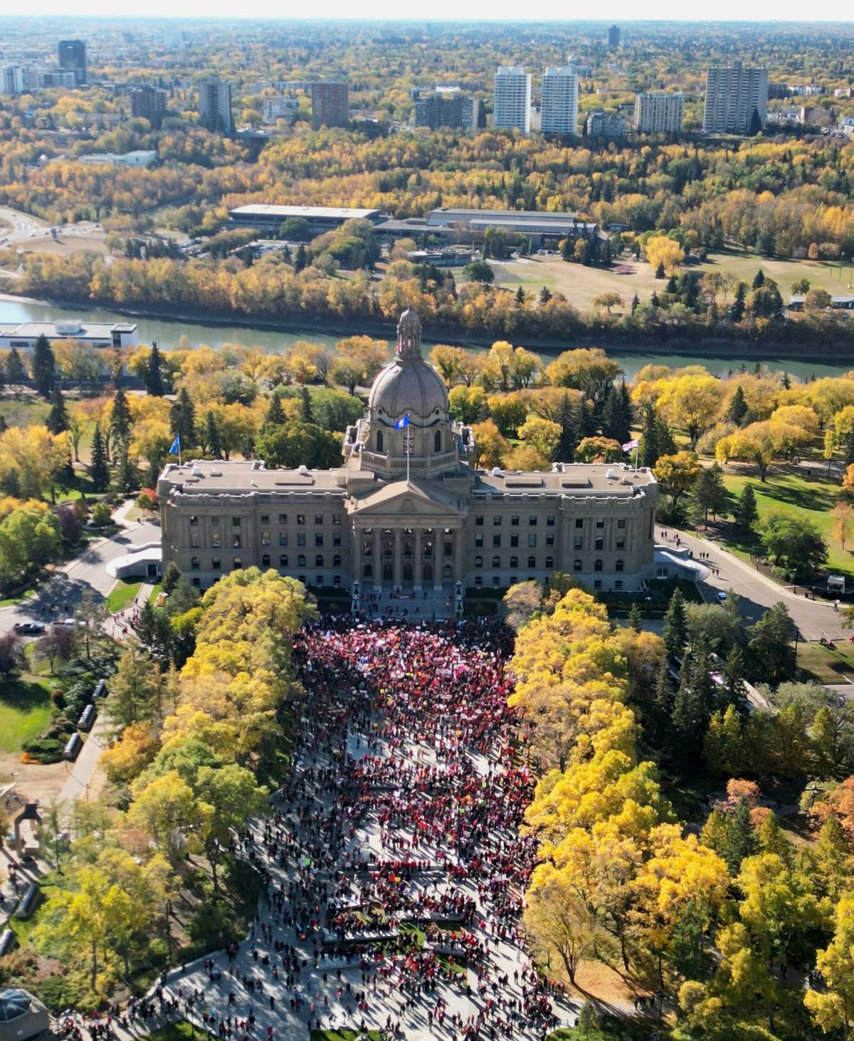 Demonstrators gather at the Alberta Legislature to protest in support of teachers ahead of the strike on Sunday, Oct. 5, 2025.