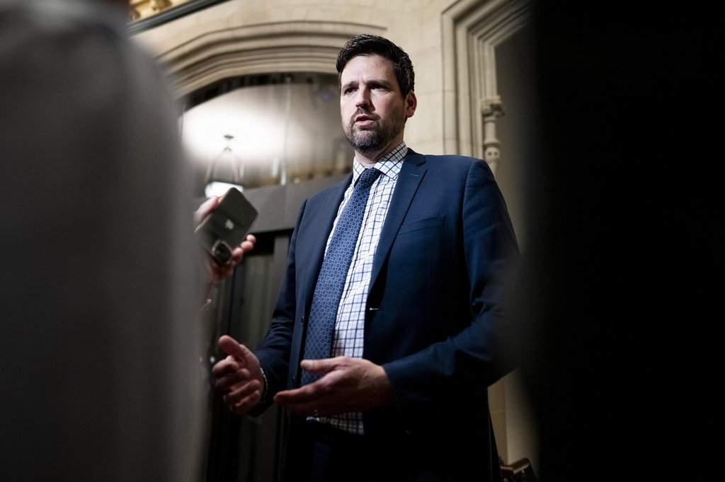 Minister of Justice Sean Fraser speaks to reporters ahead of a caucus meeting on Parliament Hill in Ottawa on Wednesday, Oct. 8, 2025.