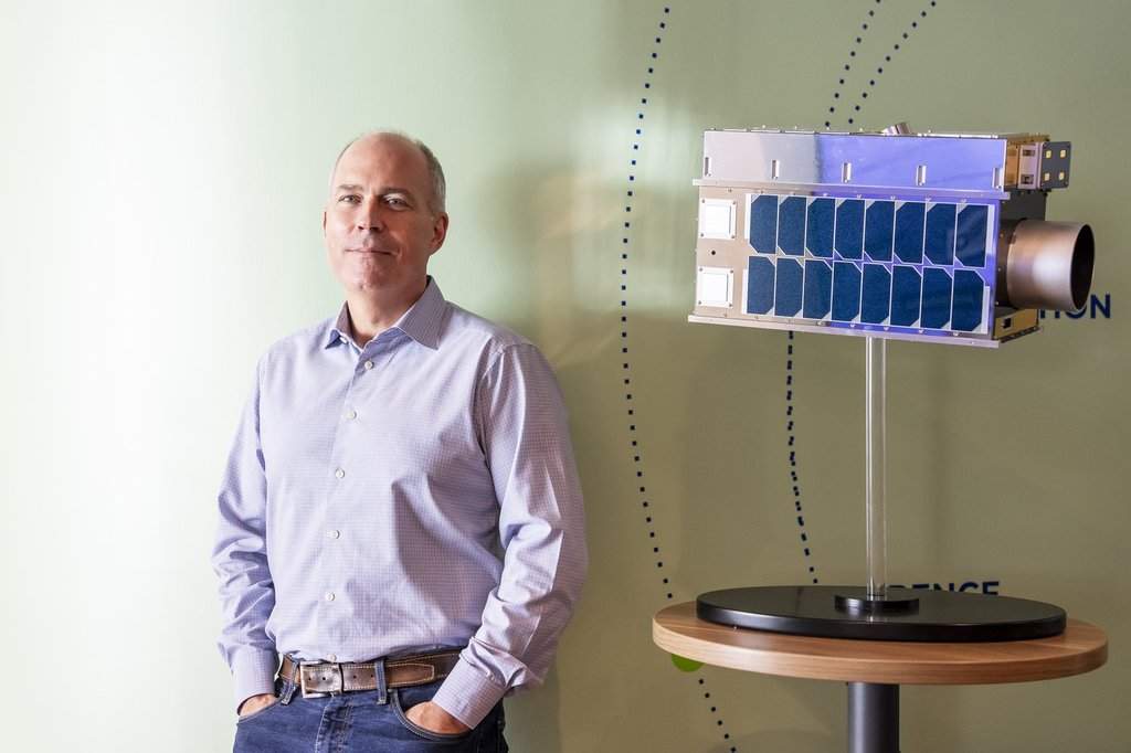 Stephane Germain, president of GHGSat Inc., poses for a photograph with a life-size model of a satellite, in their offices in Montreal on Friday, Sept. 19, 2025. THE CANADIAN PRESS/Christopher Katsarov.