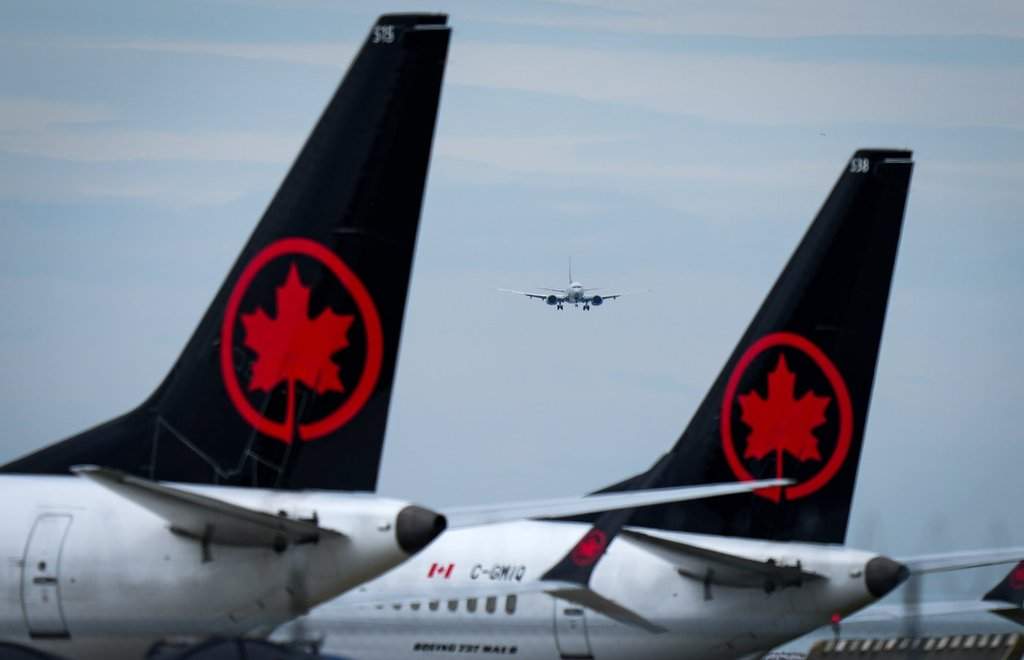 Air Canada says no injuries occurred after a ground crew member was trapped in a cargo hold on a flight departing Toronto Pearson. 