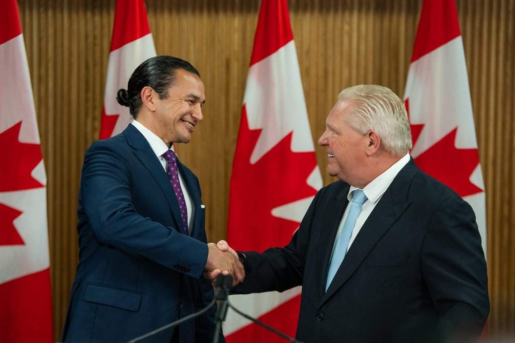 Manitoba Premier Wab Kinew, left, shakes hands with Ontario Premier Doug Ford before signing a Memorandum of Understanding at Queen’s Park in Toronto on Wednesday, May 14, 2025. THE CANADIAN PRESS/Laura Proctor.