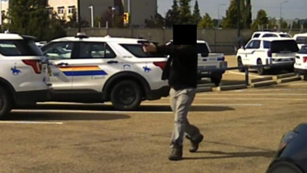 A man with a BB gun at the scene of a police shooting in the Strathcona County RCMP parking lot in Sherwood Park, Alta. on July 28, 2025.
