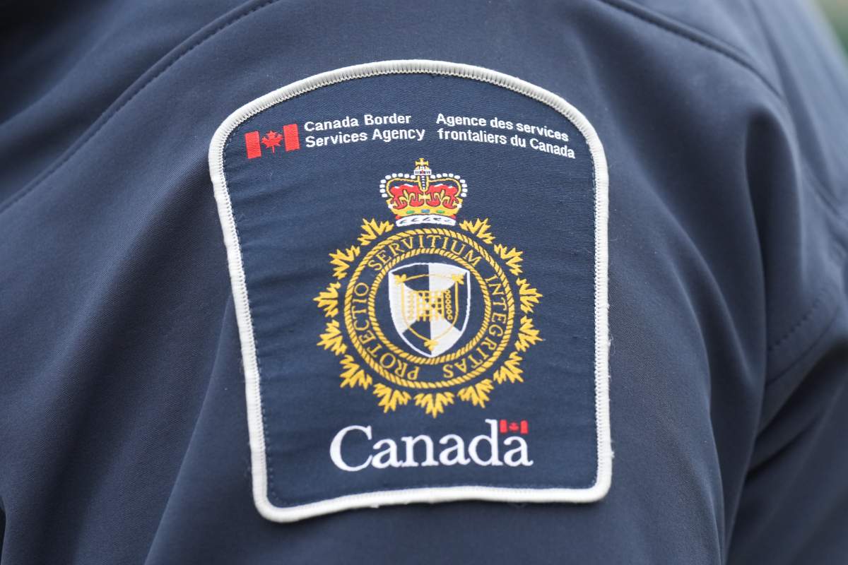 A Canada Border Services Agency patch is seen on the shoulder of a CBSA officer at the Rainbow Bridge border crossing in Niagara Falls, Ont., on Friday, Oct. 17, 2025.