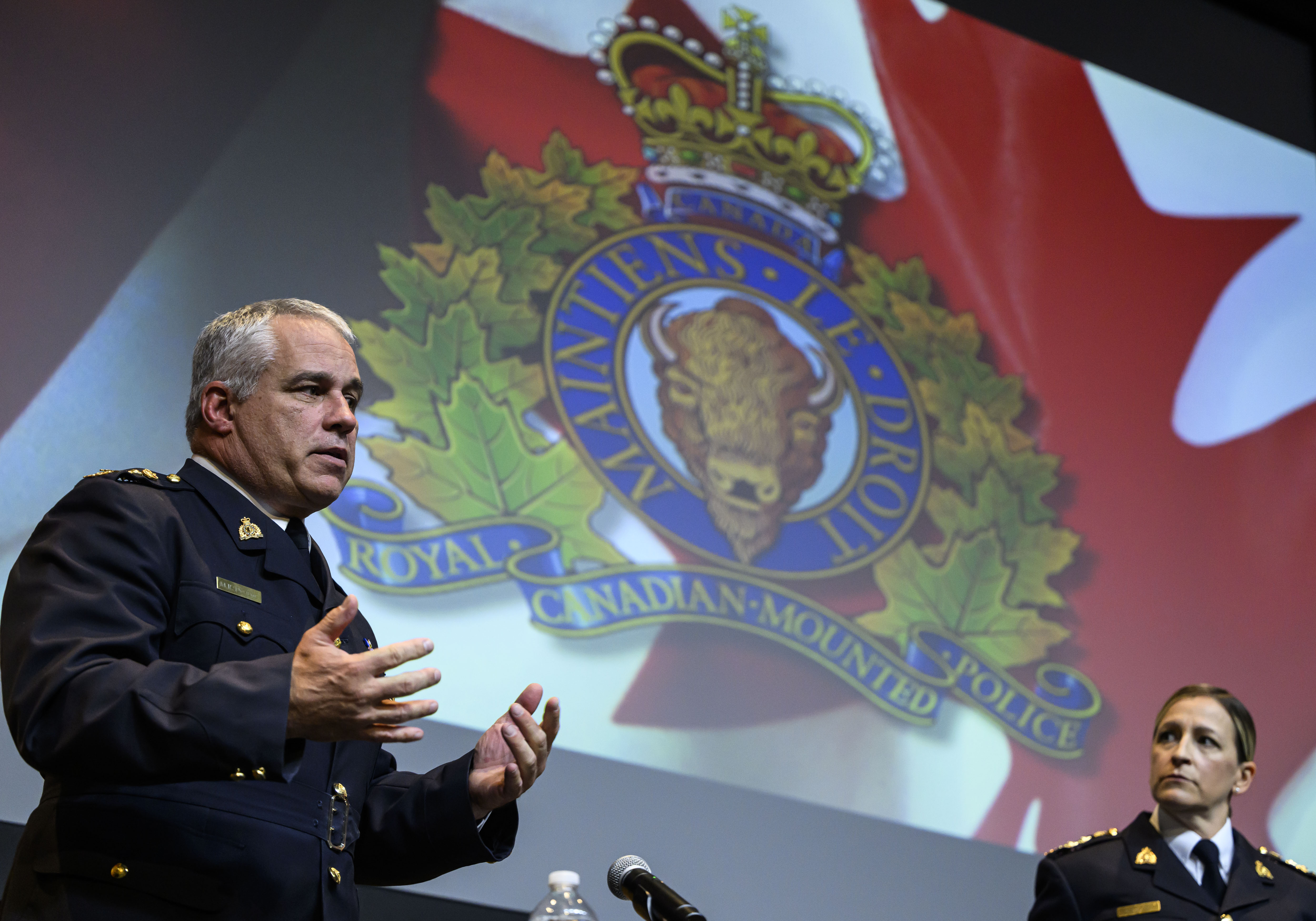RCMP Commissioner Mike Duheme, left, speaks at news conference with Assistant Commissioner Brigitte Gauvin, right, RCMP National Headquarters, Ottawa, Oct. 14, 2024. THE CANADIAN PRESS/Justin Tang