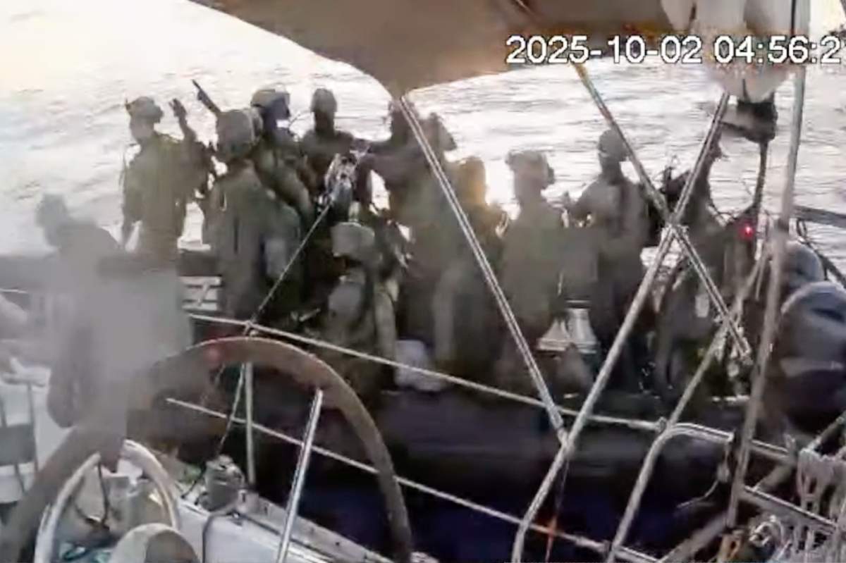 This frame grab from video released by the Global Summed Flotilla shows as Israeli navy soldiers approach one of the flotilla vessels as they approach the coast of Gaza early Thursday Oct. 2, 2025.