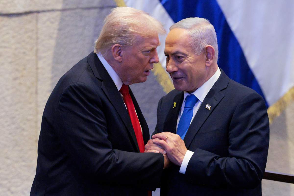 President Donald Trump talks with Israel's Prime Minister Benjamin Netanyahu at the Knesset, Israel's parliament, Monday, Oct. 13, 2025, in Jerusalem.