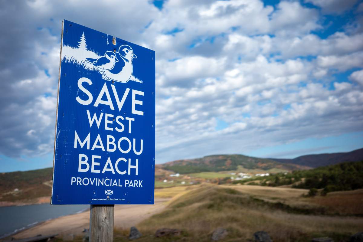 A sign saying "save West Mabou Beach" is shown at the West Mabou Beach Provincial Park in Cape Breton, N.S., on Friday Oct. 24, 2025.   