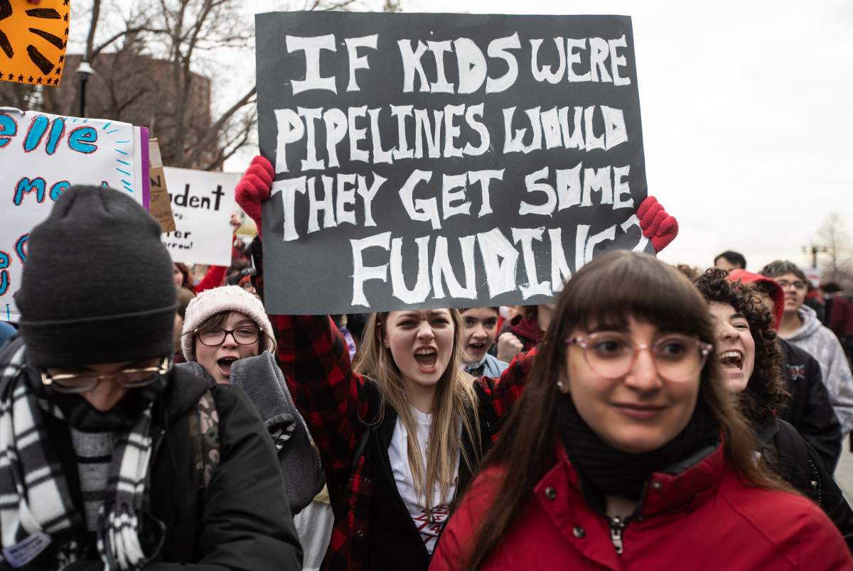 Students and supporters rally at the Alberta legislature to protest the province’s decision to order striking teachers back to work, in Edmonton on Thursday, Oct. 30, 2025. THE CANADIAN PRESS/Jason Franson