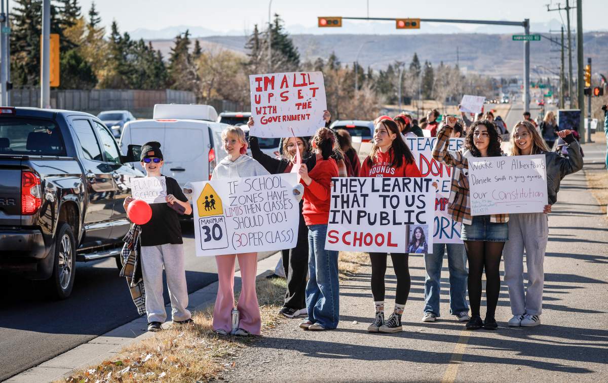 Students from Robert Thirsk High School demonstrate in support of their teachers after they were legislated back to work in Calgary, Thursday, Oct. 30, 2025.THE CANADIAN PRESS/Jeff McIntosh