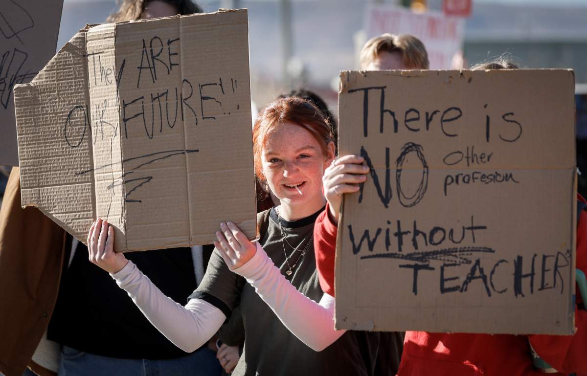 Students from Robert Thirsk High School demonstrate in support of their teachers after they were legislated back to work in Calgary, Thursday, Oct. 30, 2025.