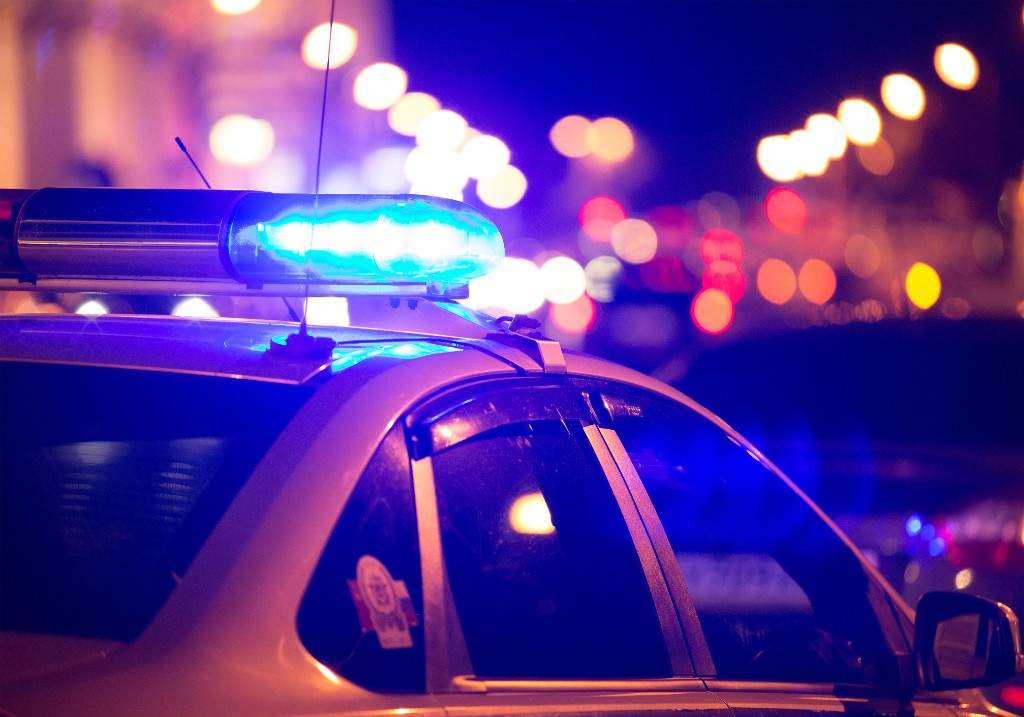 Blue light flasher atop of a police car.
