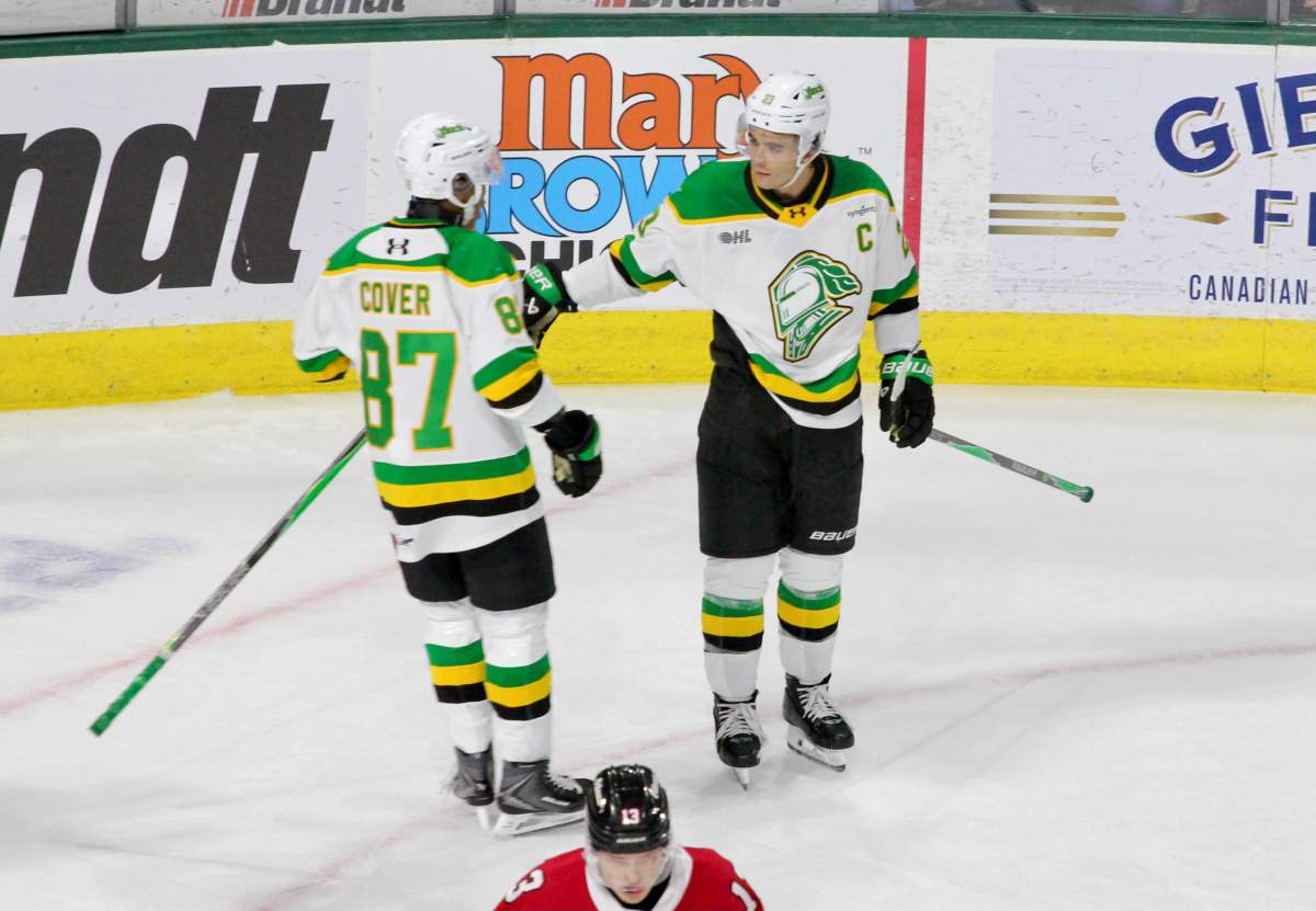 Jaxon Cover (87) and Sam O'Reilly (23) of the London Knights celebrate O'Reilly's second period goal on Oct. 24, 2025 at Canada Life Place.
