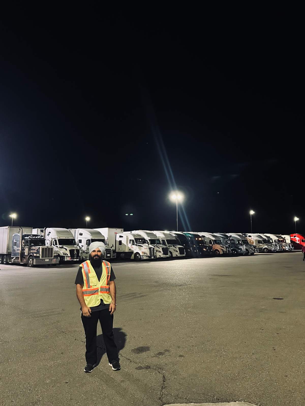 Kiratsimran Deol is among dozens of Canada-bound truckers parked at a gas station on the I-90 waiting for the border backlog to clear.