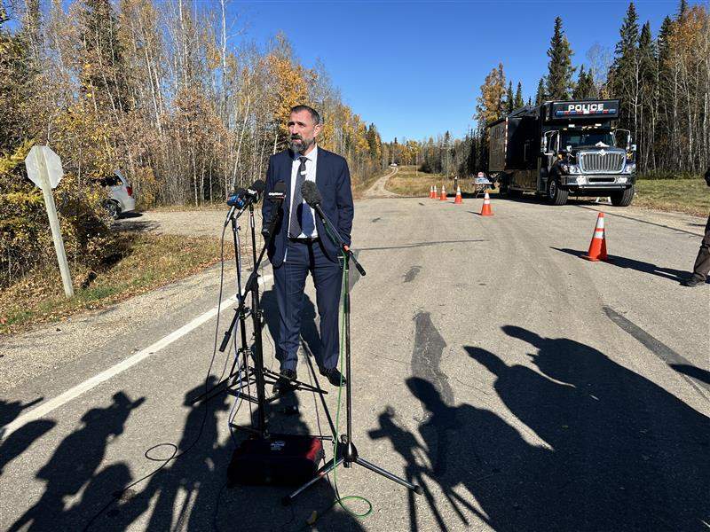 Edmonton Police Service homicide unit Det. Jared Buhler speaks to reporters about investigators searching for the remains of missing teenager Samuel Bird in the rural Carrot Creek area, west of the city in Yellowhead County, on Oct. 9, 2025.