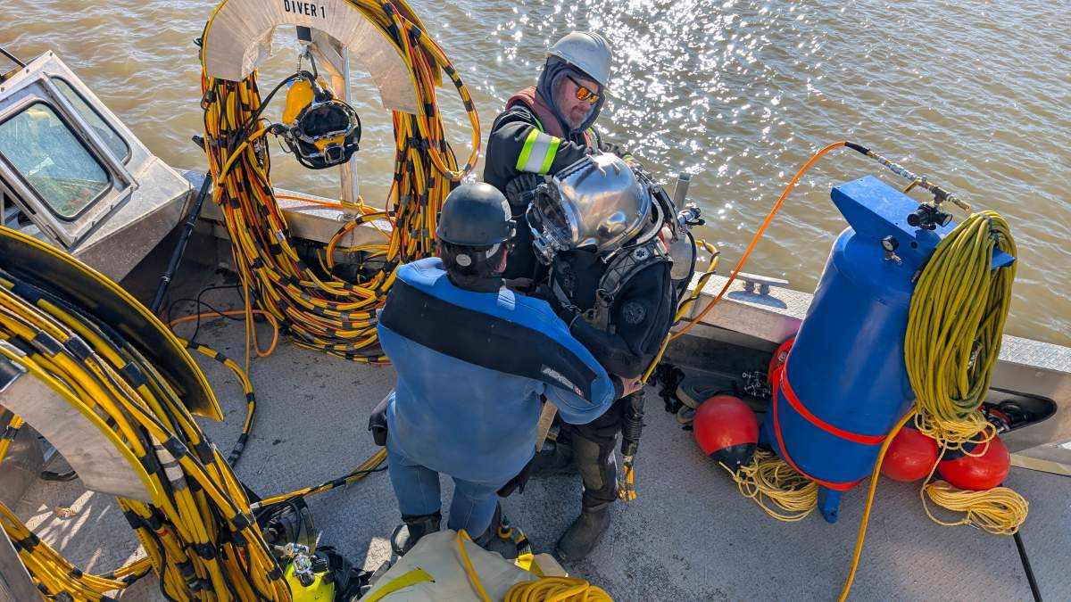 Crews work on extracting cars from the Red River.