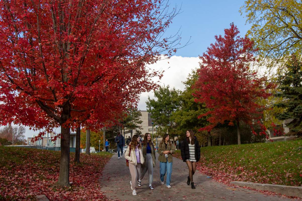 Students walk on Queen's University campus in Kingston, Ontario on Wednesday November 3, 2021.