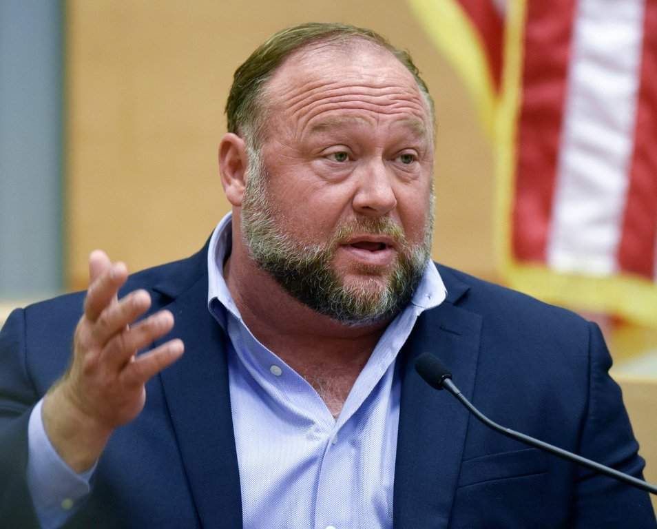 Conspiracy theorist Alex Jones takes the witness stand to testify at the Sandy Hook defamation damages trial at Connecticut Superior Court in Waterbury, Conn., Sept. 22, 2022.