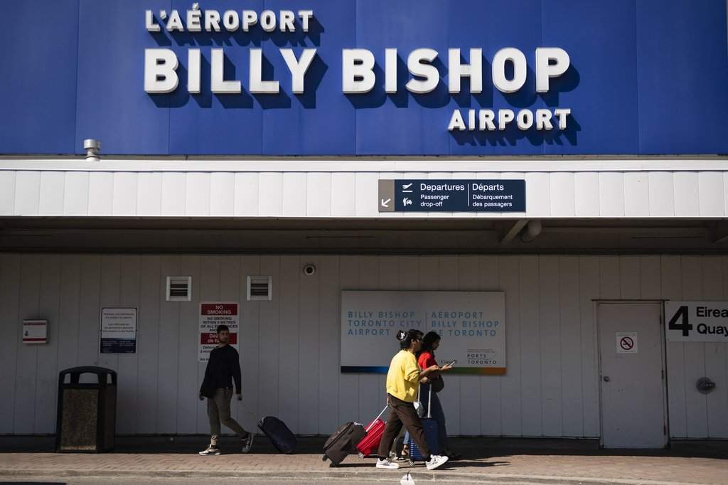 People arrive at Billy Bishop Airport in Toronto on Friday, July 19, 2024. THE CANADIAN PRESS/Christopher Katsarov.
