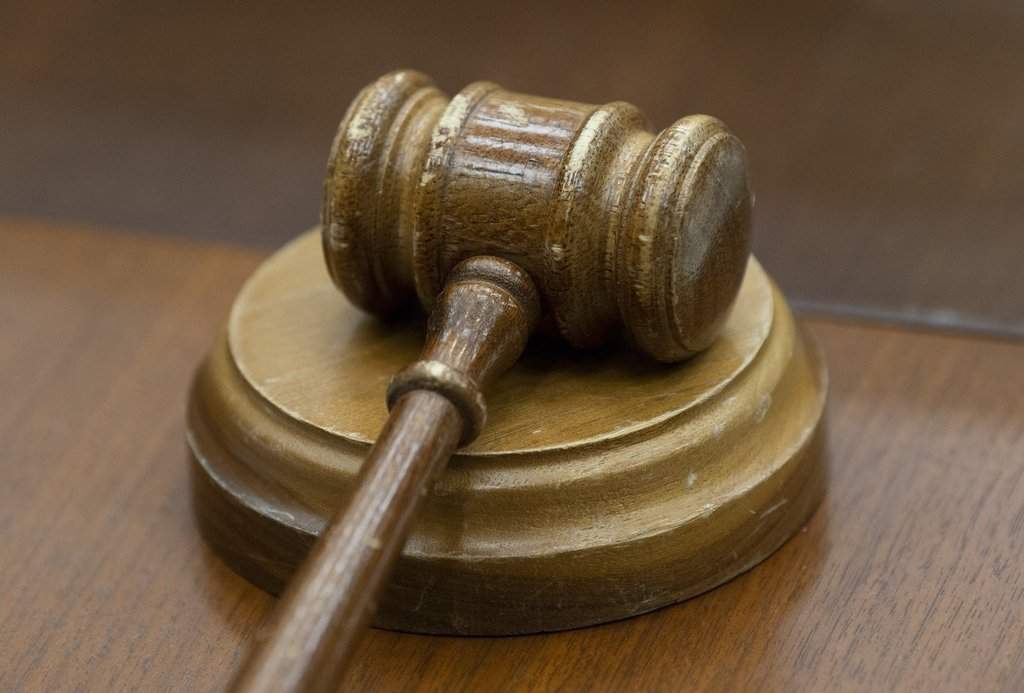 A gavel sits on a desk in Ottawa on Wednesday, Feb. 13, 2019. 