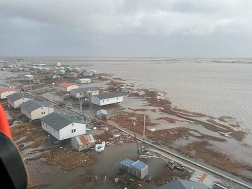In this photo provided by the U.S. Coast Guard, Kipnuk, Alaska, experiences coastal flooding, Sunday, Oct. 12, 2025.