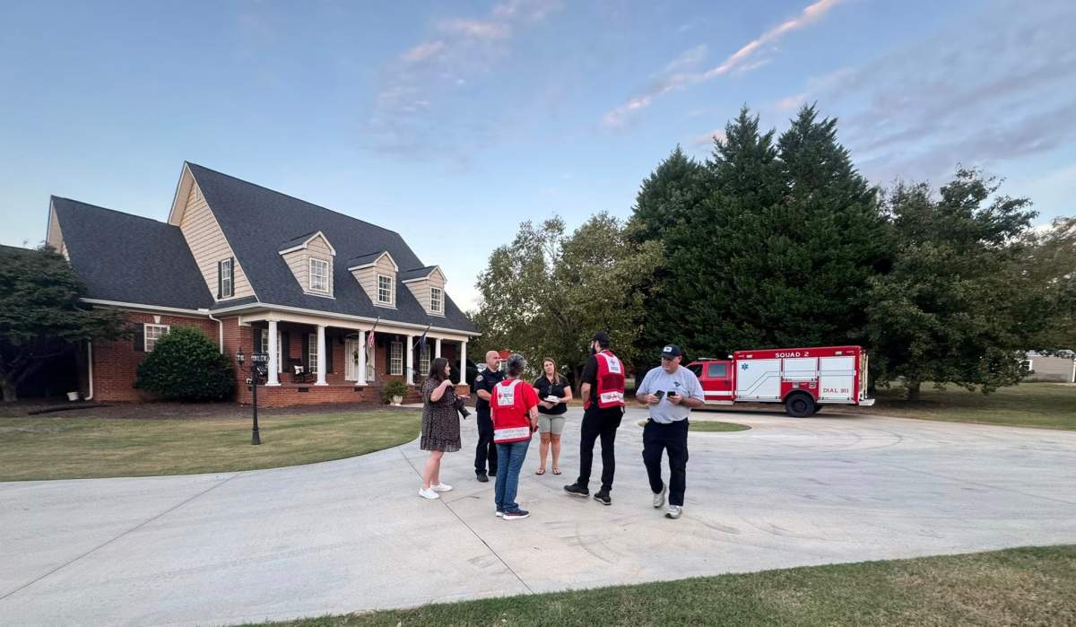 First responders partner with the Red Cross to do create a fire safety video for Fire Prevention Week, outside the Riggins Peden home.