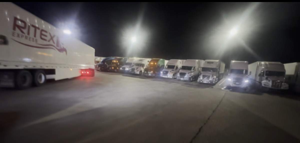 Dozens of Canada-bound trucks parked at a gas station in Ripley, N.Y., are seen on Thursday waiting for the border backlog to clear.