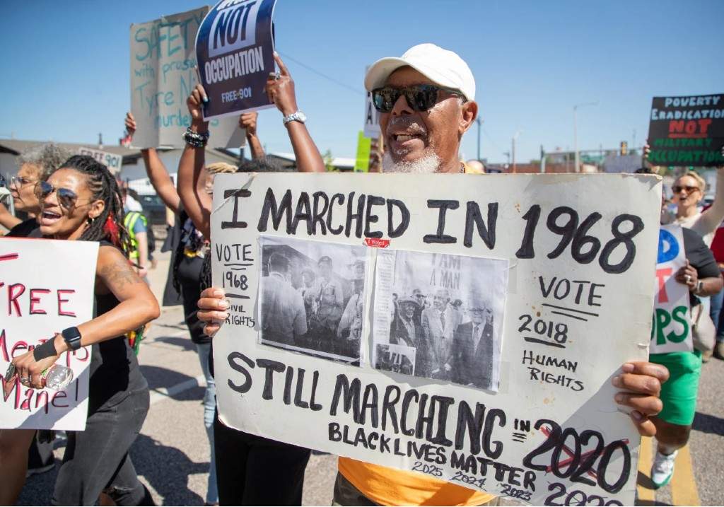 Joe Calhoun, who marched with the Memphis Sanitation Strike as an 18-year-old, joins community activists in Memphis, Tenn., Saturday, Sept. 27, 2025, joins in a march against the deployment of National Guard troops to Memphis.