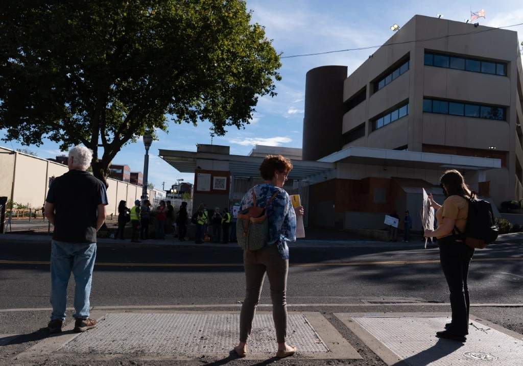People protest outside a U.S. Immigration and Customs Enforcement facility on Sunday, Sept. 28, 2025, in Portland, Ore.