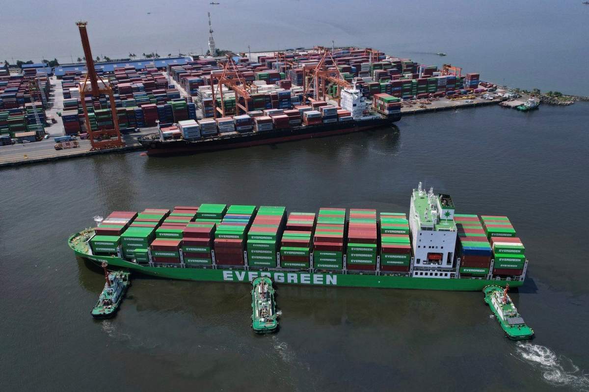 FILE - Tugboats assist a container ship as it prepares to dock at the Manila International Container Terminal at the Philippine capital April 8, 2025. (AP Photo/Aaron Favila, File).