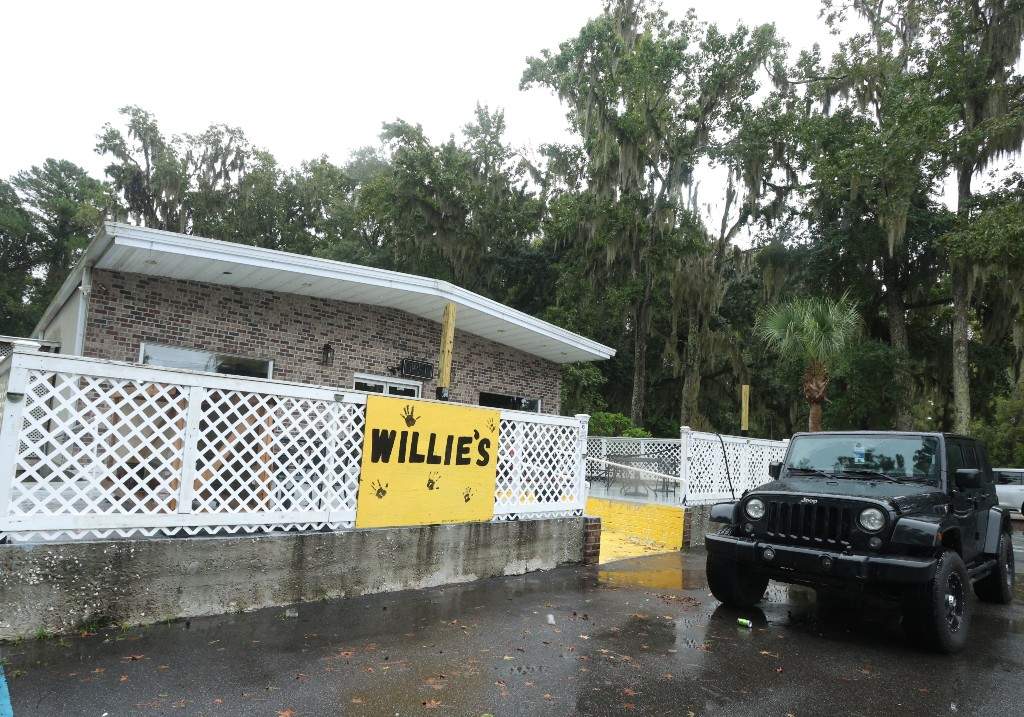 A vehicle is parked outside of Willie's Bar and Grill in St Helena Island, S.C. after a shooting occurred early Sunday, Oct. 12, 2025.