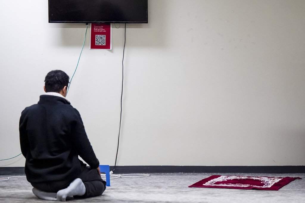 A student performs his afternoon prayer in a prayer room at Concordia University in Montreal, on Wednesday, Nov. 26, 2025.