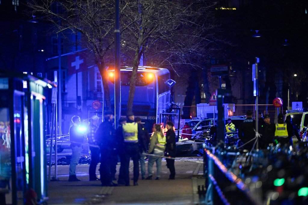 A double-decker bus crashed into a bus shelter in Stockholm on Friday, Nov. 14, 2025, causing fatalities and injuries. (Henrik Montgomery/TT News Agency via AP)