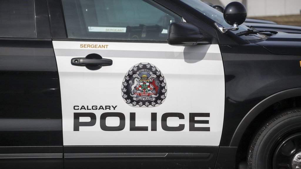 A Calgary Police Service logo is seen on a vehicle parked at headquarters in Calgary, Alta., April 9, 2020. THE CANADIAN PRESS/Jeff McIntosh.