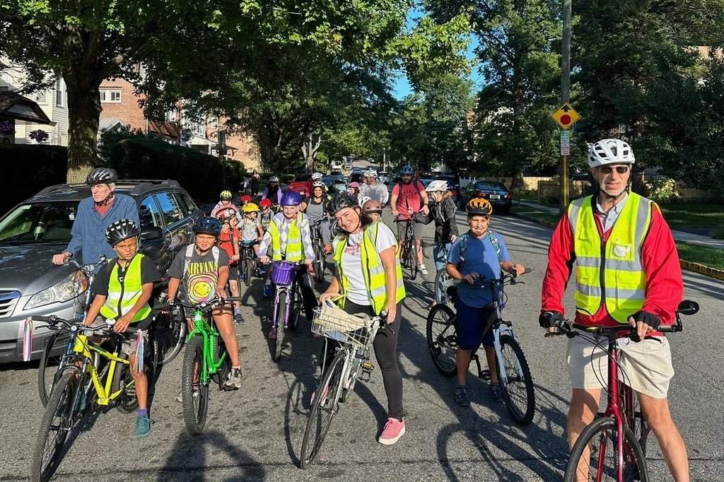 Children ride their bicycles to school during a parent-led bike ride titled "Bike Bus" Sept. 15, 2025, in Montclair, N.J. (Andrew Hawkins/Montclair Bike Bus via AP).