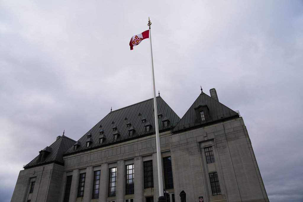 The flag of the Supreme Court of Canada flies on the east flagpole in Ottawa on Monday, Nov. 28, 2022. THE CANADIAN PRESS/Sean Kilpatrick.