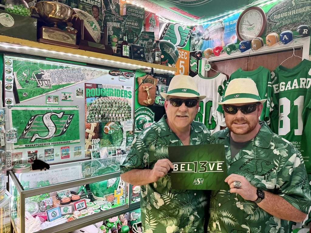 Lance Hackewich, left, a Roughriders superfan, poses for a photo in Regina with his son Nelson in a Tuesday, Nov. 11, 2025, handout photo.  THE CANADIAN PRESS/Handout - Lance Hackewich (Mandatory Credit).