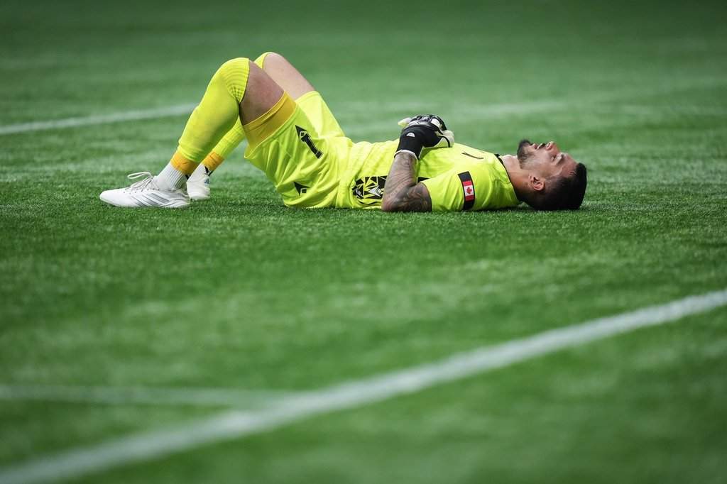 Valour FC goalkeeper Eleias Himaras lies on the field after the Vancouver Whitecaps defeated Valour FC during a Canadian Championship quarterfinal soccer match, in Vancouver, B.C., Wednesday, July 9, 2025.