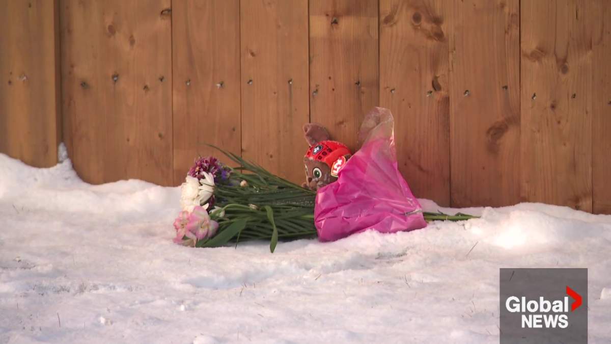 A memorial outside a unit that caught fire at the Clareview Village townhouse complex near 31 Street and 132A Avenue in the Belmont neighbourhood on Nov. 28, 2025.