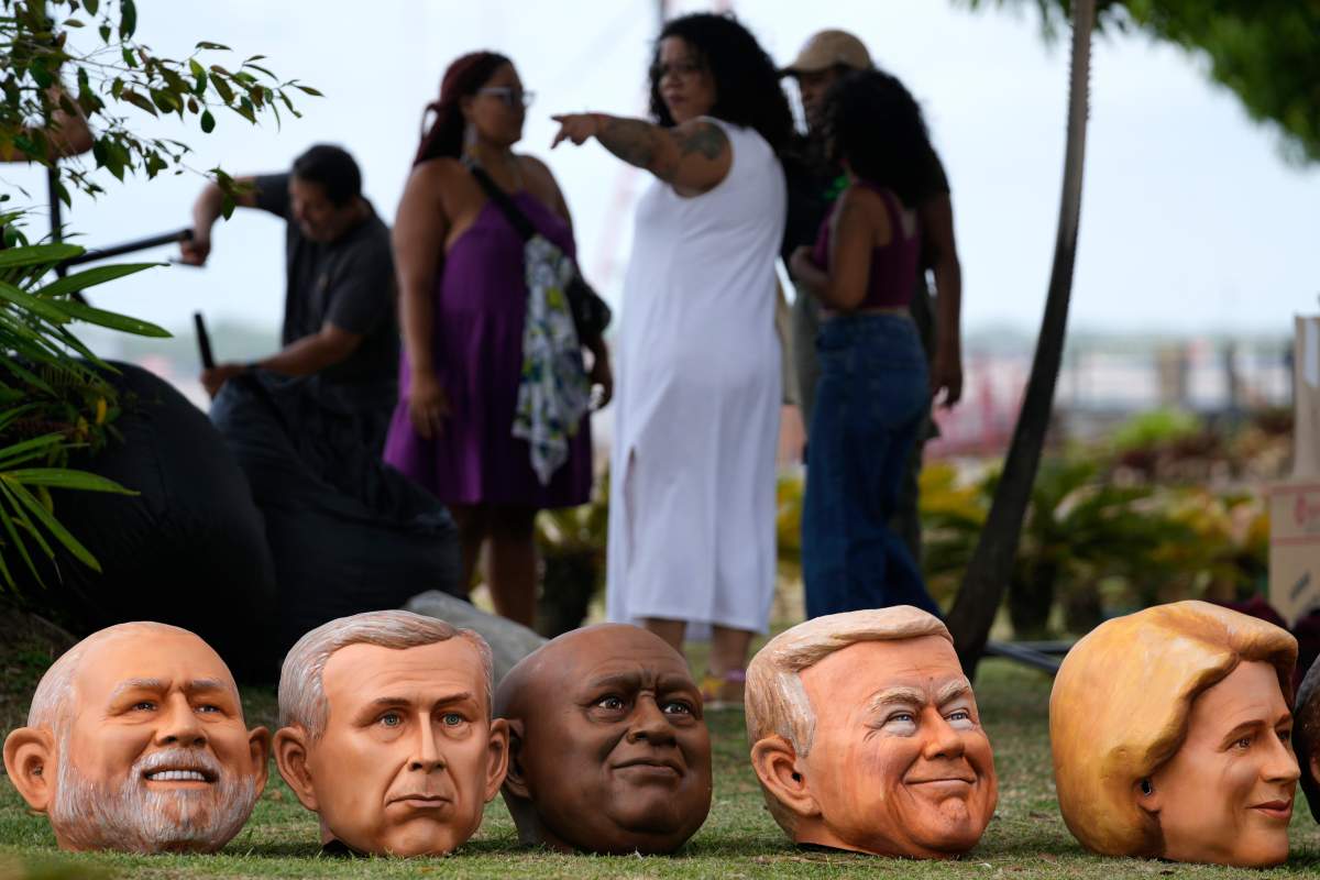 Puppet heads of world leaders, including Prime Minister Mark Carney (second from left) are lined up before a protest at the COP30 U.N. Climate Summit, in Brazil on Wed. Nov. 5, 2025.