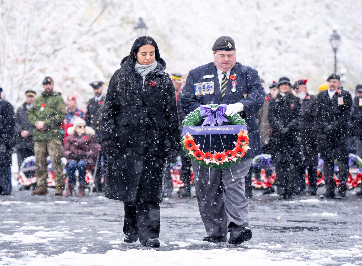 Mayor-elect Soraya Martinez Ferrada, assisted by Terrance Deslage, places wreath at the cenotaph during a Remembrance Day ceremony, in Montreal, Tuesday, Nov. 11, 2025.