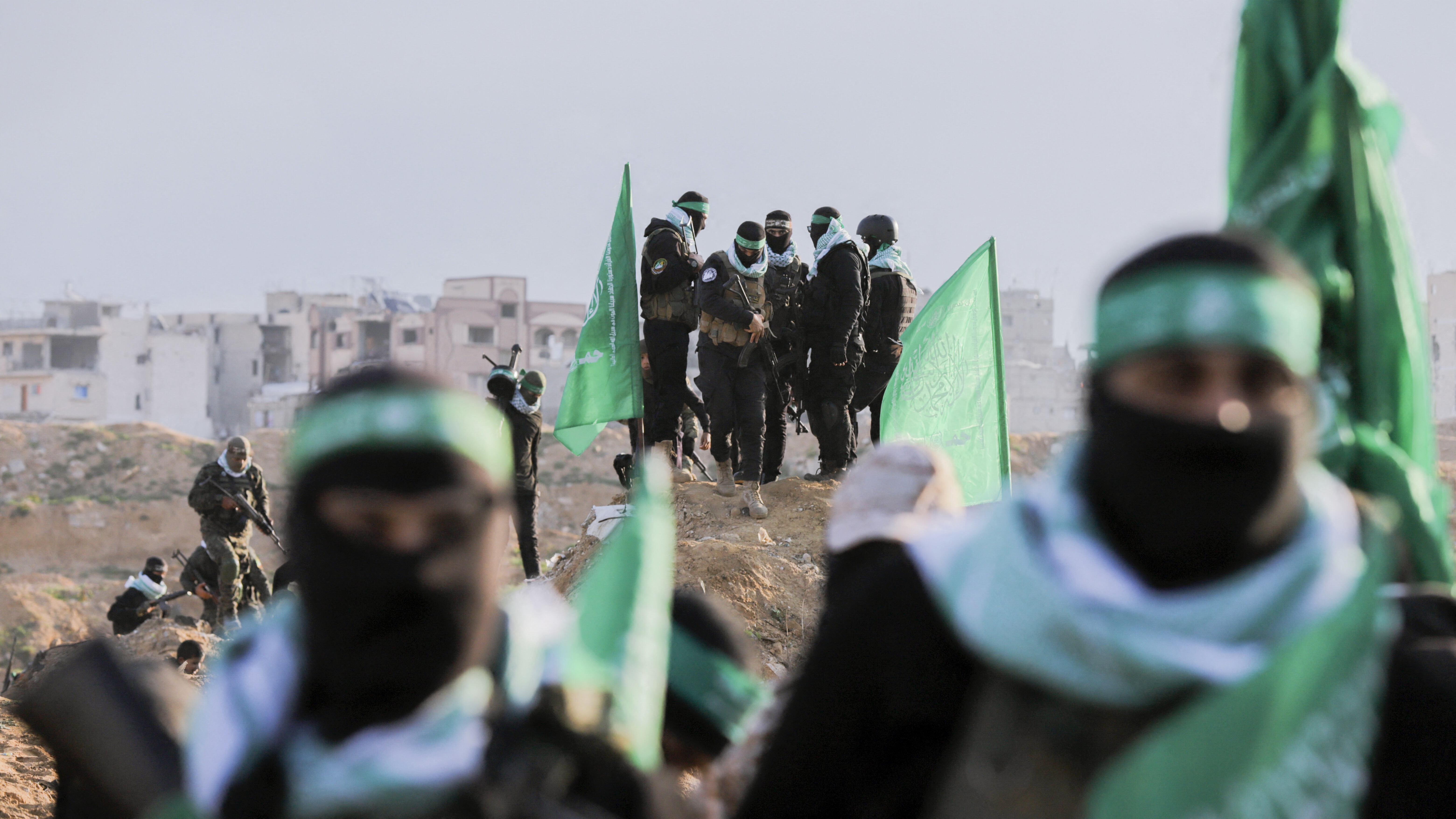 Hamas fighters at the site of the handover of the bodies of four Israeli hostages in Khan Yunis, Gaza, Feb. 20, 2025. Photo by Saeed Jaras/Middle East Images/ABACAPRESS.COM