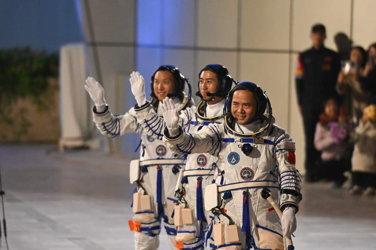 Chinese astronauts Zhang Lu (front), Wu Fei (C) and Zhang Hongzhang attend a send-off ceremony at the Jiuquan Satellite Launch Center in northwest China on Oct. 31, 2025.