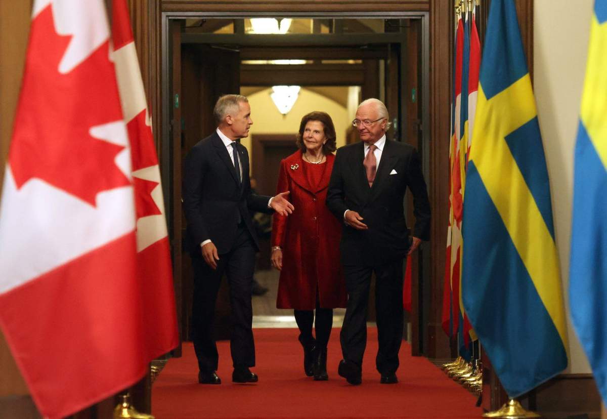 Prime Minister Mark Carney and Sweden's King Carl XVI Gustaf and Queen Silvia arrive at a welcoming ceremony on Parliament Hill in Ottawa, Tuesday, Nov. 18, 2025. 