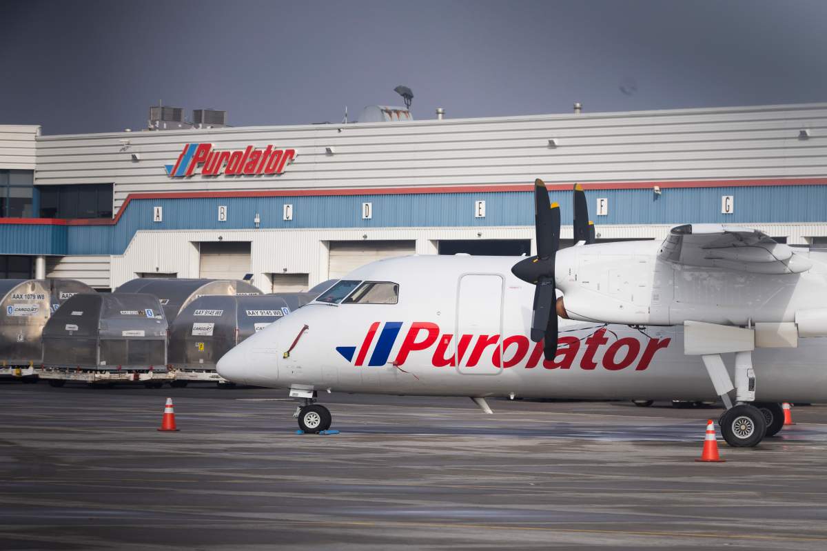 A Purolator plane sits on the tarmac at the John C. Munro Hamilton International Airport in Hamilton, Ont., Friday, Feb. 23, 2024.