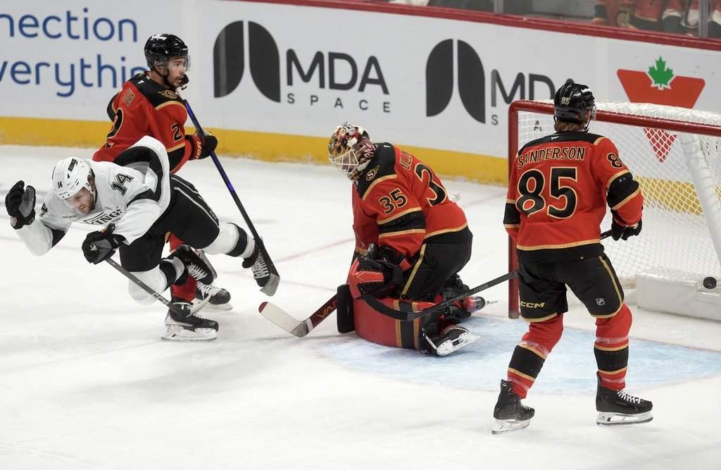 Ottawa Senators defenceman Jake Sanderson (85) and defenceman Artem Zub (2) look on as Los Angeles Kings right wing Alex Laferriere (14) celebrates his goal on goaltender Linus Ullmark (35) as he falls to the ice 
during first period NHL action in Ottawa, Saturday, Nov. 15, 2025. THE CANADIAN PRESS/Adrian Wyld.