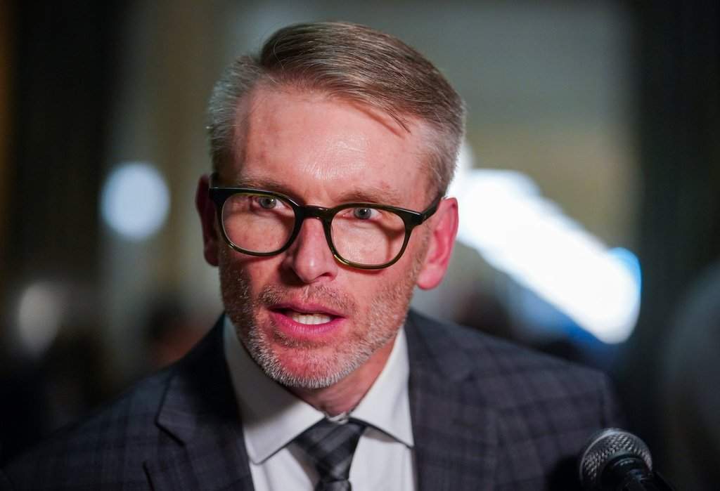 Saskatchewan Education Minister Everett Hindley looks on during a media scrum after speech from the throne in Regina, on Wednesday, Oct. 22, 2025. 