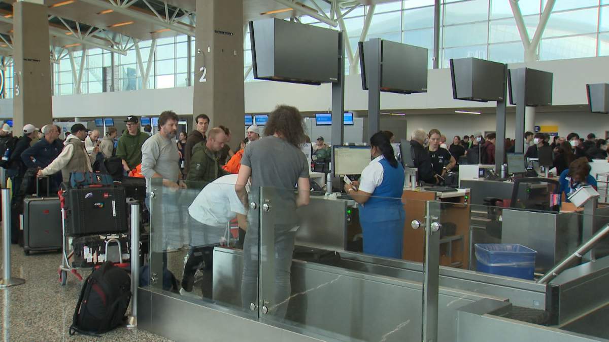 There were long lineups of passengers at Calgary International Airport on Monday as travelers scrambled to make alternate arrangements following the cancellation or delay of dozens of flights, caused by the snow that fell on the city overnight.